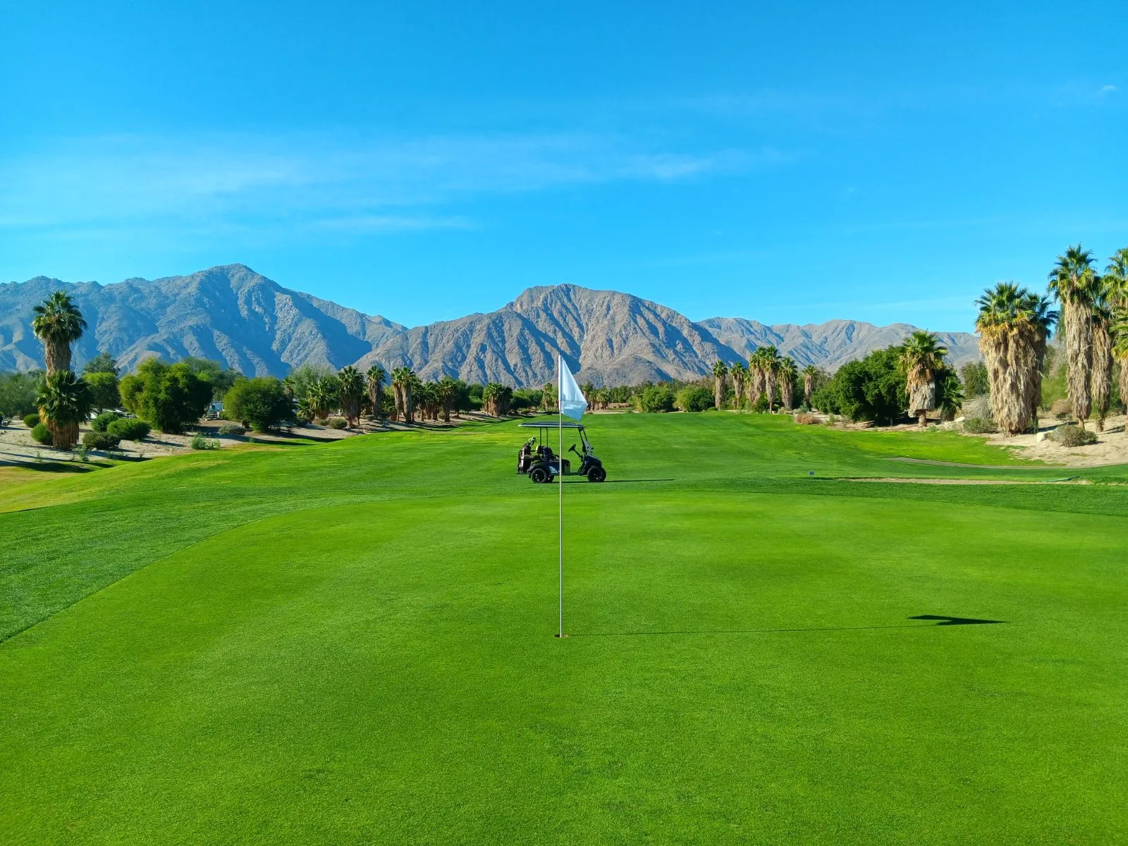 On the green with mountain views